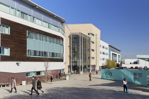 Image of YC University Centre, showing modern buildings with students outside